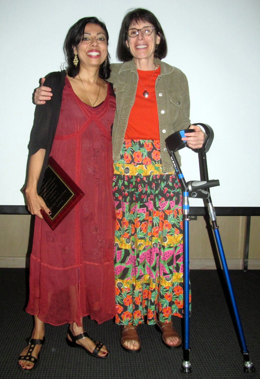 Dr. Meg Newman awarding Dr. Monica Gandhi the award in 2012