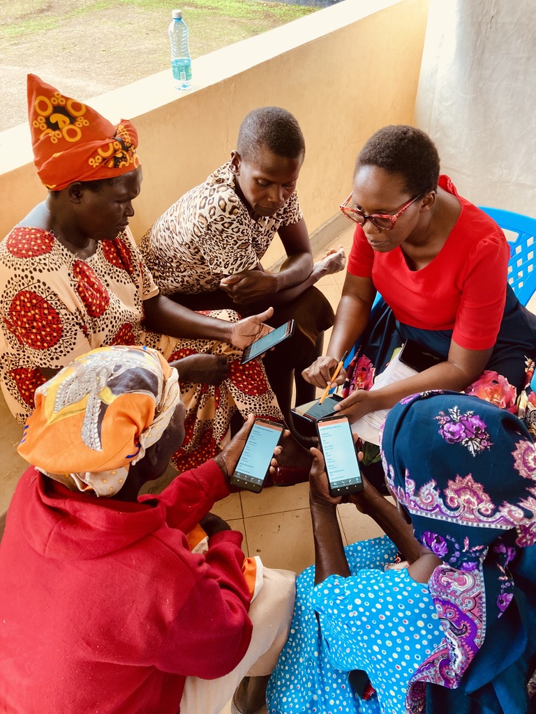 Community health workers learning how to use smartphones for telehealth.