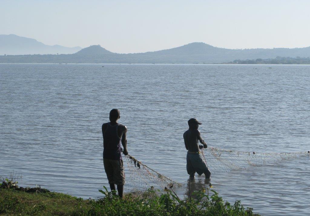 Fishermen at lake