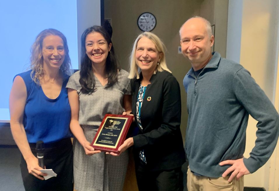 Carina accepting the award with Lillian Brown, Steve Deeks, and Diane Havlir